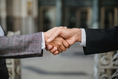 What methods does negotiation psychology offer you? two hands shaking